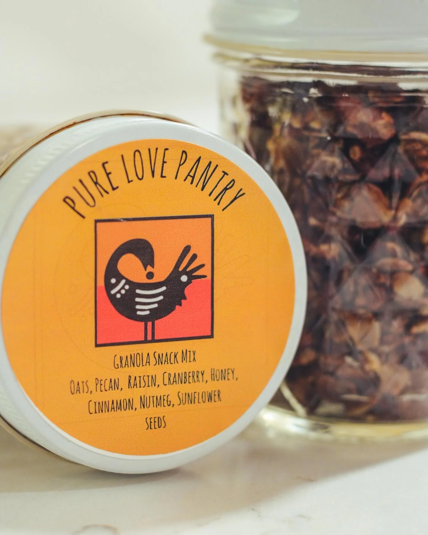 Close-up of Pure Love Pantry granola snack mix packaging