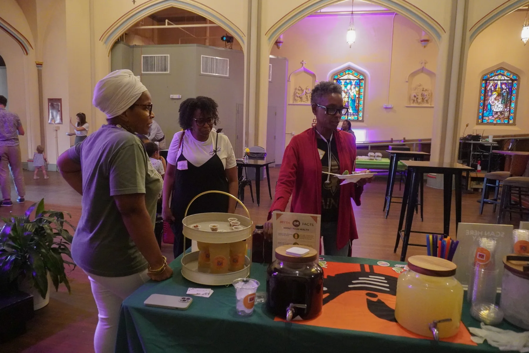 Pure Love Pantry wellness table at a community gathering
