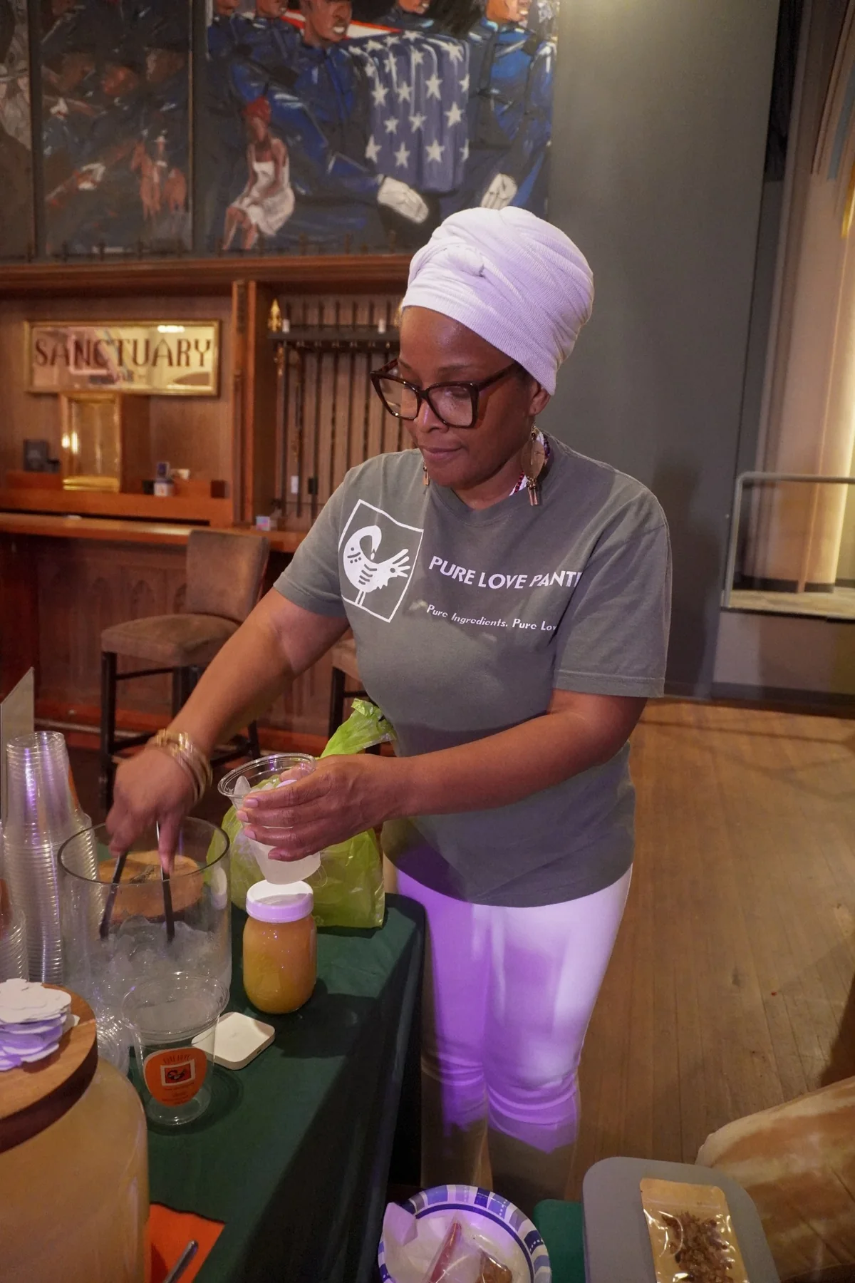 Wendy Firven preparing a fresh drink at a community event