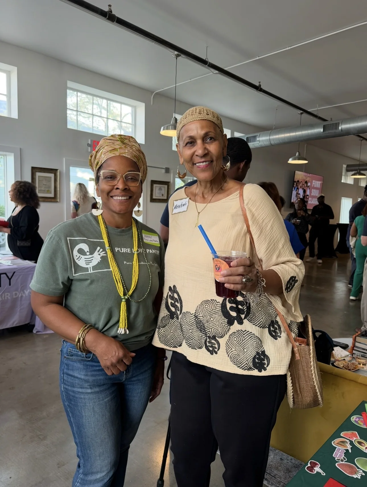 Wendy Firven with a guest at an indoor wellness event