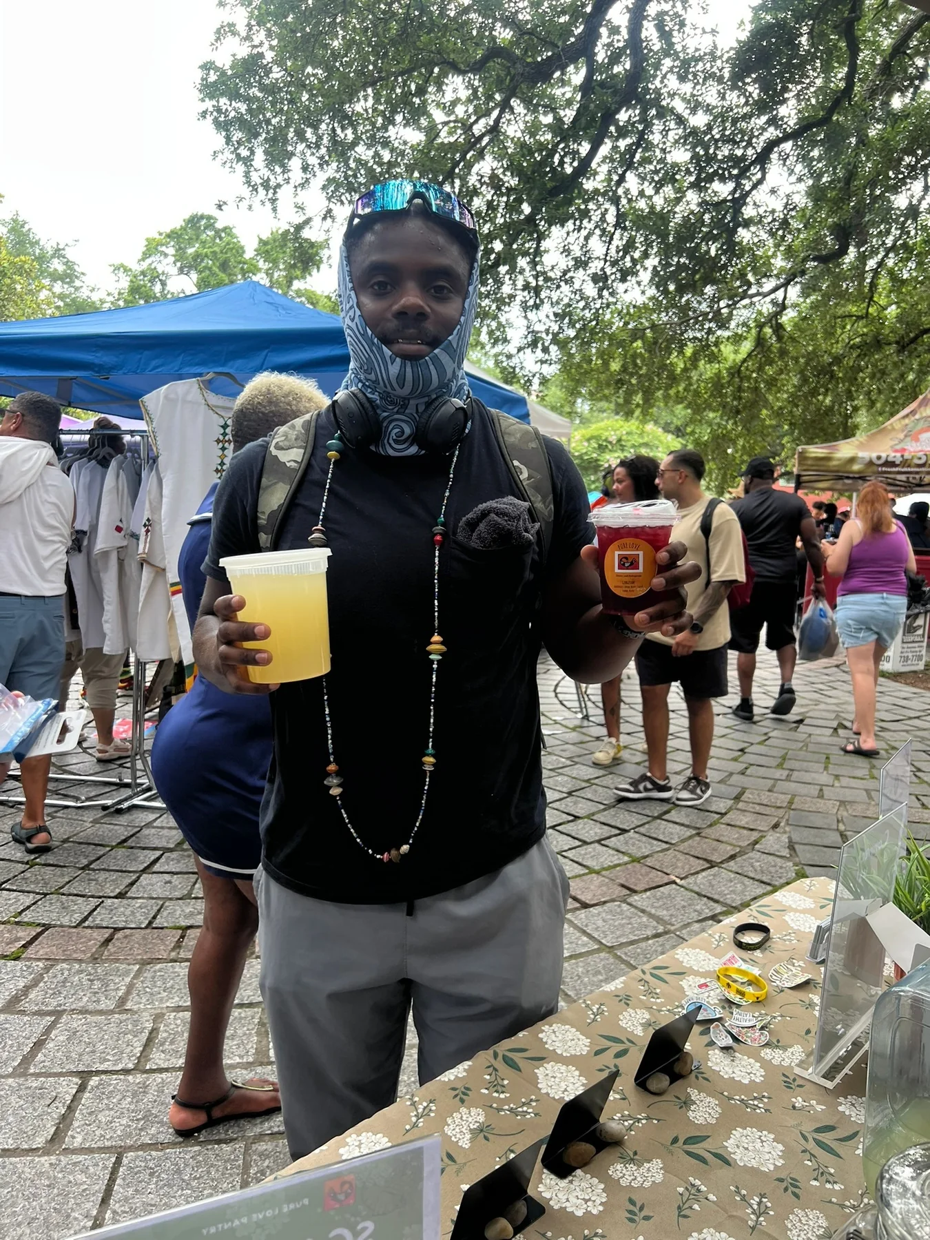 A guest displaying two Pure Love Pantry drinks