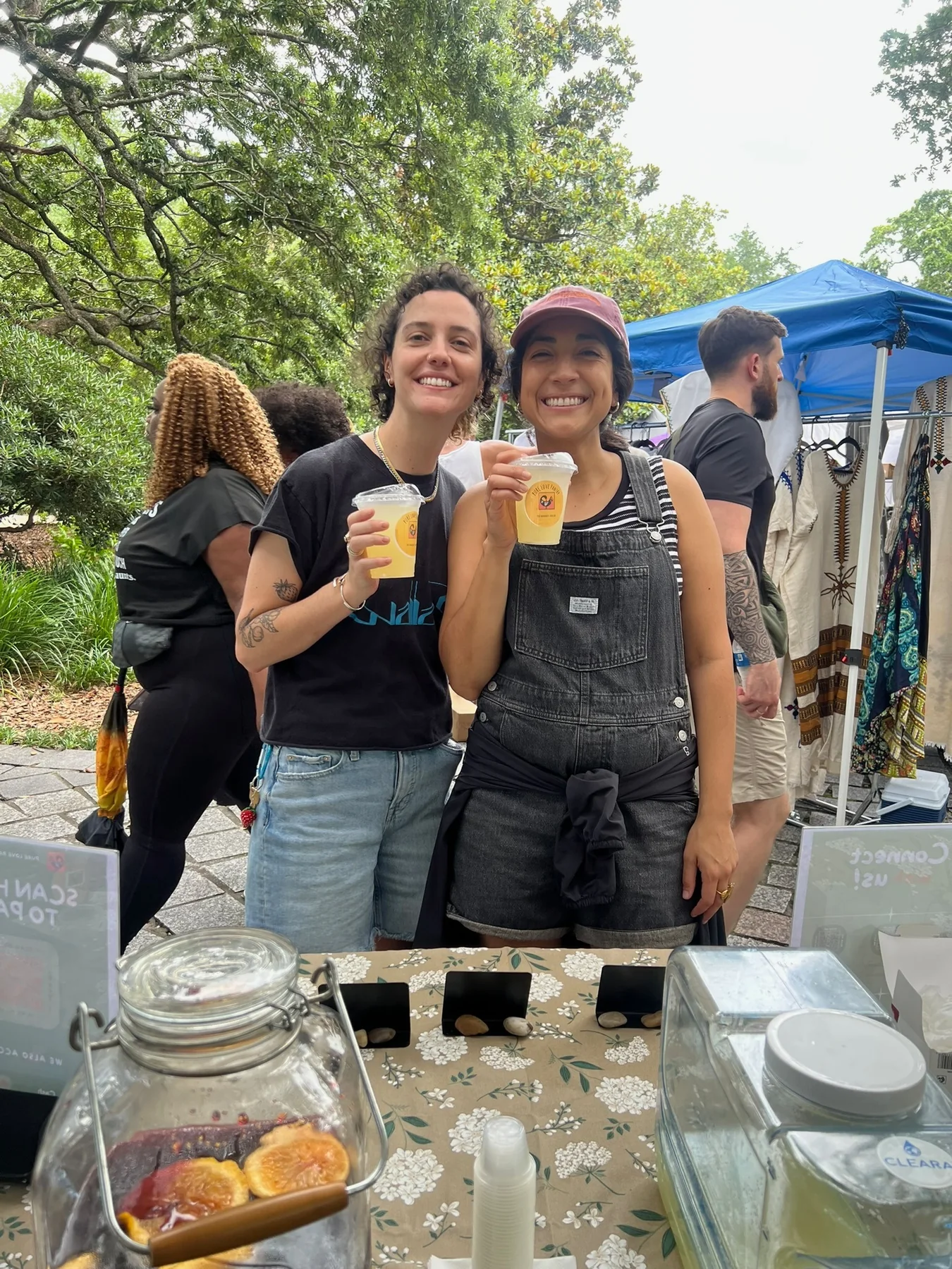 Two smiling guests holding Pure Love Pantry gingerade