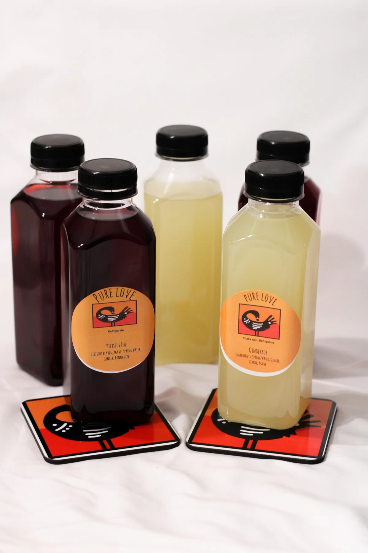 Pure Love Pantry hibiscus tea and gingerade bottle collection