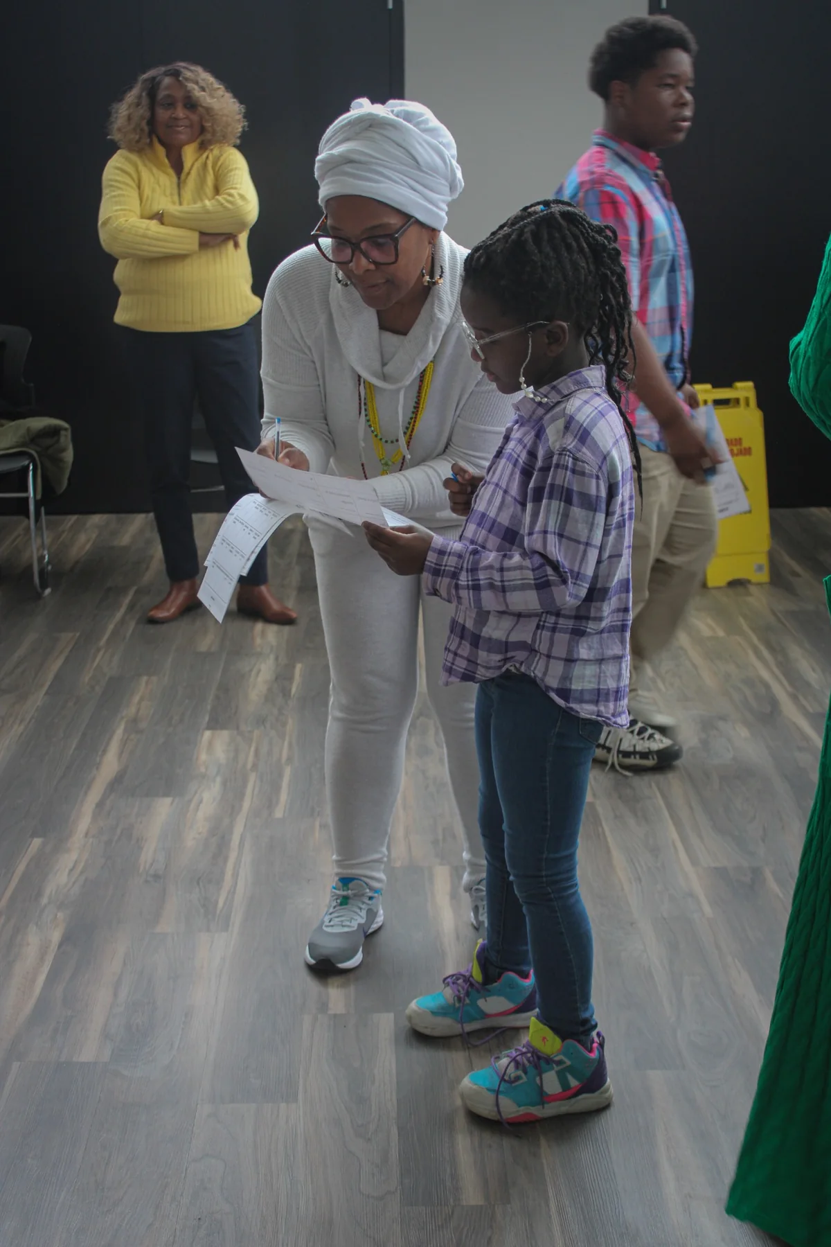 Wendy Firven helping a child with a wellness activity